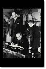 Ernest Blevins of the United Kingdom's Ministry of Foreign Affairs signs the NATO treaty