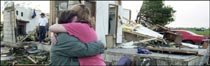 Residents in Missouri cry after a tornado hits their home