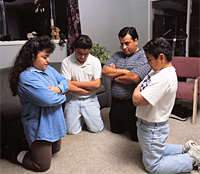 A Mormon family in prayer