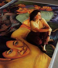 Muralist Judy Baca with one of her works