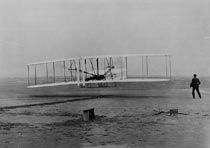 First Flight: Orville Wright pilots the Wright Flyer in 1903 for 12 seconds