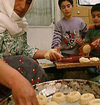 Middle Eastern family spending time together in the kitchen