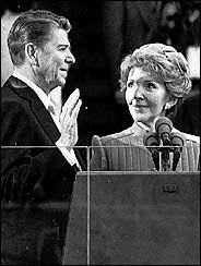 Ronald Reagan taking the presidential oath standing next to his wife, Nancy, in 1981