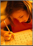 A girl working on a homework assignemnt.