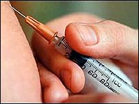 A patient gets a shot of flu vaccine.