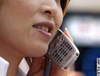A woman talking on a mobile phone.