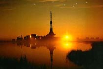 An oil rig on the northern coast at Prudhoe Bay as the sun sets.
