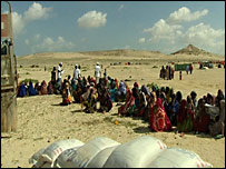 Somalis await food and medical aid, part of life here in this relatively lawless country.