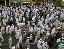 Muslim pilgrims leave the Great Mosque after attending Friday noon prayers in Mecca, Saudi Arabia.