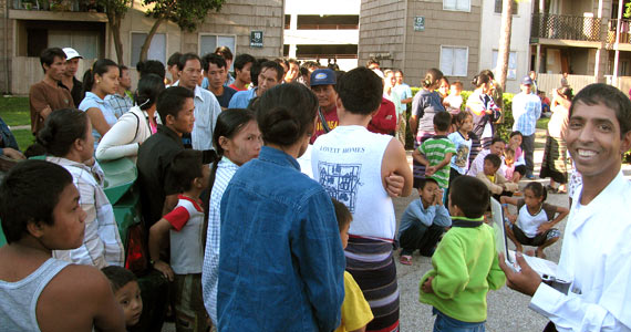 Burmese refugee John Glenn, far right, was resettled in January in Houston, where he tries to help his other refugees in his apartment complex navigate a new world. (Mike Giglio / The Salt Lake Tribune)